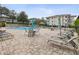 Inviting pool area with lounge chairs and patio tables at 1524 Lakeview Rd # 103, Clearwater, FL 33756