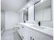 Contemporary bathroom with double vanity, quartz countertop, and large mirrors at 4008 W Olive St, Tampa, FL 33616