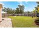 Landscaped backyard with fire pit and wooden fence at 809 41St N Ave, St Petersburg, FL 33703