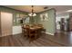 Bright dining room with wood table and chairs, and an open view to the kitchen at 809 41St N Ave, St Petersburg, FL 33703