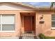 Orange house exterior with a stained glass front door at 809 41St N Ave, St Petersburg, FL 33703