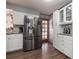 Modern kitchen with stainless steel appliances and white cabinetry at 809 41St N Ave, St Petersburg, FL 33703