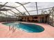 Inviting kidney-shaped pool with covered patio at 809 41St N Ave, St Petersburg, FL 33703