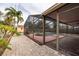 Screened pool area with brick pavers and a large covered patio at 809 41St N Ave, St Petersburg, FL 33703