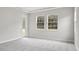 Bedroom with gray carpet, neutral walls, and door to backyard at 12823 Daleridge Pl, Riverview, FL 33579