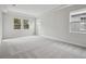 Spacious bedroom with gray carpet and multiple windows at 12823 Daleridge Pl, Riverview, FL 33579