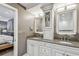 Elegant double vanity bathroom with granite countertop and custom cabinetry at 5101 W Platt St, Tampa, FL 33609