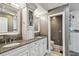 Elegant bathroom with double vanity and walk-in shower at 5101 W Platt St, Tampa, FL 33609