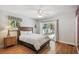 Comfortable guest bedroom with hardwood floors and wood furniture at 5101 W Platt St, Tampa, FL 33609