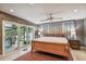 Main bedroom with sliding glass doors leading to the patio at 5101 W Platt St, Tampa, FL 33609