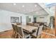 Dining room features a large wooden table and hardwood floors at 5101 W Platt St, Tampa, FL 33609