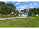 House exterior showcasing a large yard and driveway at 5101 W Platt St, Tampa, FL 33609