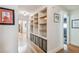 Bright hallway with built-in shelving and hardwood floors at 5101 W Platt St, Tampa, FL 33609