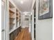 Light hallway, built-in shelves, hardwood floors at 5101 W Platt St, Tampa, FL 33609