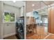 Laundry room with washer, dryer and glass-walled view into dining area at 5101 W Platt St, Tampa, FL 33609