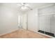 Simple bedroom design with closet shelving, neutral walls, and lots of light at 6611 14Th N St, St Petersburg, FL 33702