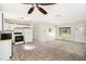 Bright kitchen featuring white appliances, a ceiling fan, and ample natural light at 6611 14Th N St, St Petersburg, FL 33702