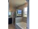 Bathroom with shower, tub, and water view at 1027 Ocean Spray Dr, Ruskin, FL 33570