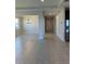 Long hallway with tile floors and access to other rooms at 1027 Ocean Spray Dr, Ruskin, FL 33570