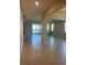 View down a spacious hallway with tile floors and natural light at 1027 Ocean Spray Dr, Ruskin, FL 33570