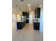 Modern kitchen with island, stainless steel appliances and granite countertops at 1027 Ocean Spray Dr, Ruskin, FL 33570
