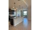 Modern kitchen featuring dark cabinetry, granite counters, and stainless steel appliances at 1027 Ocean Spray Dr, Ruskin, FL 33570