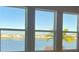 Living room with large windows and water view at 1027 Ocean Spray Dr, Ruskin, FL 33570