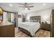 Main bedroom with wood floors and access to private balcony at 104 Cypress Pond Rd, Palm Harbor, FL 34683