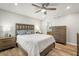 Bright bedroom with a king-size bed and en-suite bathroom at 104 Cypress Pond Rd, Palm Harbor, FL 34683