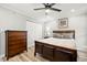 Bedroom with wood-look flooring features ceiling fan, dresser, and closet at 104 Cypress Pond Rd, Palm Harbor, FL 34683