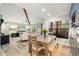 Bright dining area with view into living room and access to patio at 104 Cypress Pond Rd, Palm Harbor, FL 34683