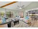 Bright living room with vaulted ceilings, comfy seating, and access to balcony at 104 Cypress Pond Rd, Palm Harbor, FL 34683