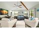 Open living room with hardwood floors and comfortable seating at 104 Cypress Pond Rd, Palm Harbor, FL 34683