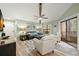 Spacious living room with vaulted ceilings and a cozy seating area at 104 Cypress Pond Rd, Palm Harbor, FL 34683