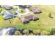 Aerial view of home with large backyard and a pond at 2104 Hembury Pl # 33, Sun City Center, FL 33573