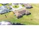 A high angle of a cozy home with a well-maintained lawn and a serene pond, creating a peaceful and inviting atmosphere at 2104 Hembury Pl # 33, Sun City Center, FL 33573