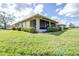 Well-maintained lawn and screened in porch offer great outdoor living space at 2104 Hembury Pl # 33, Sun City Center, FL 33573