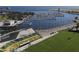 Aerial view showcases waterfront stadium, marina with docked boats, and palm-lined streets on a bright day at 301 1St S St # 1104, St Petersburg, FL 33701