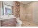 Modern bathroom with dual shower heads and floral wallpaper at 301 1St S St # 1104, St Petersburg, FL 33701