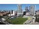 Dynamic cityscape featuring modern high-rise buildings overlooking a green stadium on a bright, clear day at 301 1St S St # 1104, St Petersburg, FL 33701