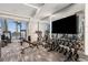 Modern gym with exercise machines, weights, and a TV for an immersive workout experience with a view at 301 1St S St # 1104, St Petersburg, FL 33701