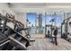 The modern fitness center has treadmills, ellipticals, weights and ocean views at 301 1St S St # 1104, St Petersburg, FL 33701