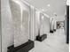 Bright, modern hallway features marble floors, recessed lighting and decorative sculptures at 301 1St S St # 1104, St Petersburg, FL 33701