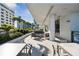 Outdoor lounge area with tables, chairs, lush landscaping, and open spaces on a sunny day at 301 1St S St # 1104, St Petersburg, FL 33701