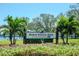 Welcoming sign for North Straub Park surrounded by vibrant flowers and palm trees on a sunny day at 301 1St S St # 1104, St Petersburg, FL 33701