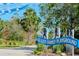 Inviting entrance to Glazer Gathering Playground with lush greenery and clear signage on a sunny day at 301 1St S St # 1104, St Petersburg, FL 33701