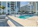 Sparkling pool with steps, lounge chairs, and sunny skies offers a place to relax and enjoy your day at 301 1St S St # 1104, St Petersburg, FL 33701