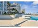 Rooftop swimming pool with clear blue water, light tiled deck and city views at 301 1St S St # 1104, St Petersburg, FL 33701