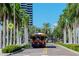 Street view with trolley car, palm trees, and picturesque buildings at 301 1St S St # 1104, St Petersburg, FL 33701