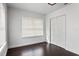 Bedroom with dark hardwood floors and window at 1713 E Chelsea St, Tampa, FL 33610